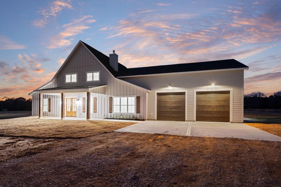 Front exterior of a new home in , New Waverly, TX, highlighting curb appeal (Image 26).