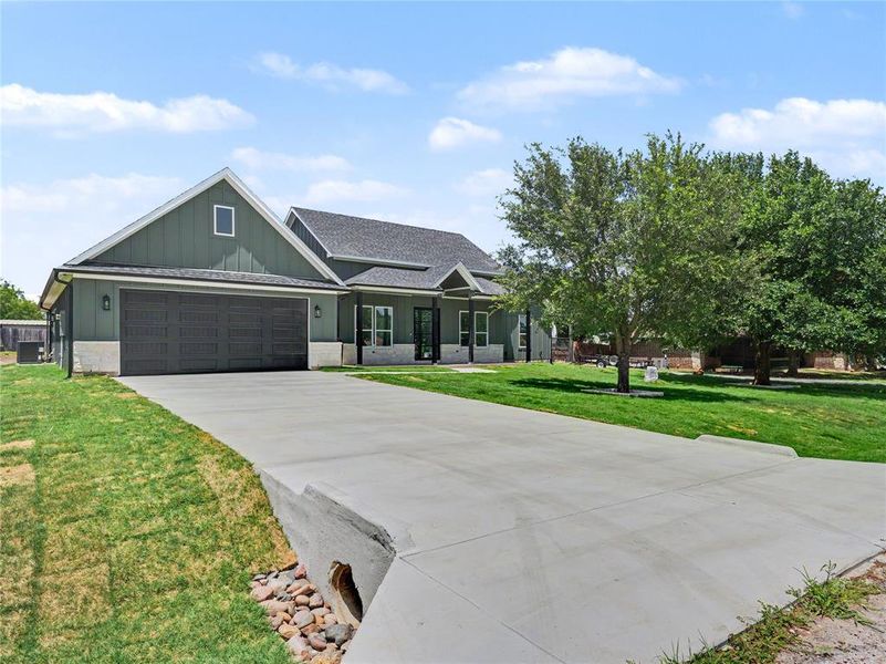 Contemporary exterior with board and batten siding and stone accents Contemporary exterior with board and batten siding and stone accents