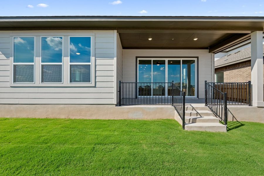 Exterior details and patio area of a home in Arbor Collection at Lariat, Liberty Hill (Image 24). Exterior details and patio area of a home in Arbor Collection at Lariat, Liberty Hill (Image 24).