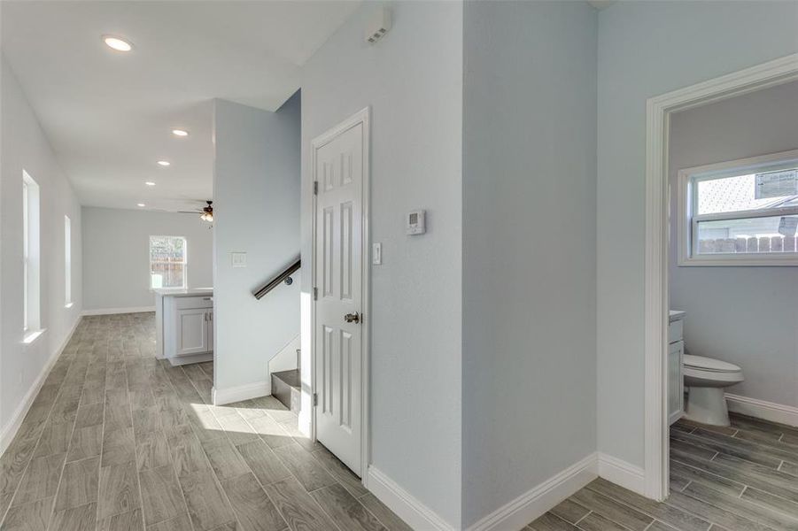 Hallway with light wood-type flooring