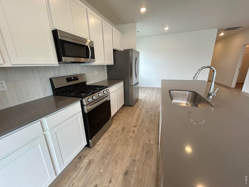 Furnished interior view inside a new home in Union Colony West, Greeley (Image 7).