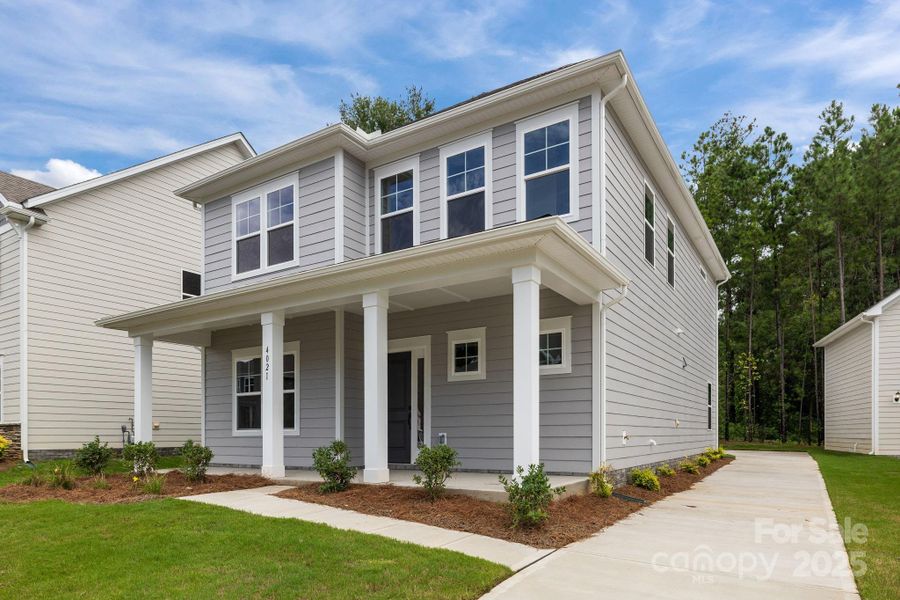 Front exterior of a new home in Arbor Village, Matthews, NC, highlighting curb appeal (Image 2).