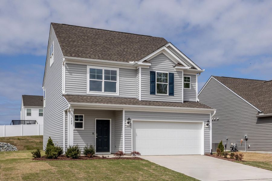 Front exterior of a new home in Daniel Farms, Benson, NC, highlighting curb appeal (Image 2). Front exterior of a new home in Daniel Farms, Benson, NC, highlighting curb appeal (Image 2).