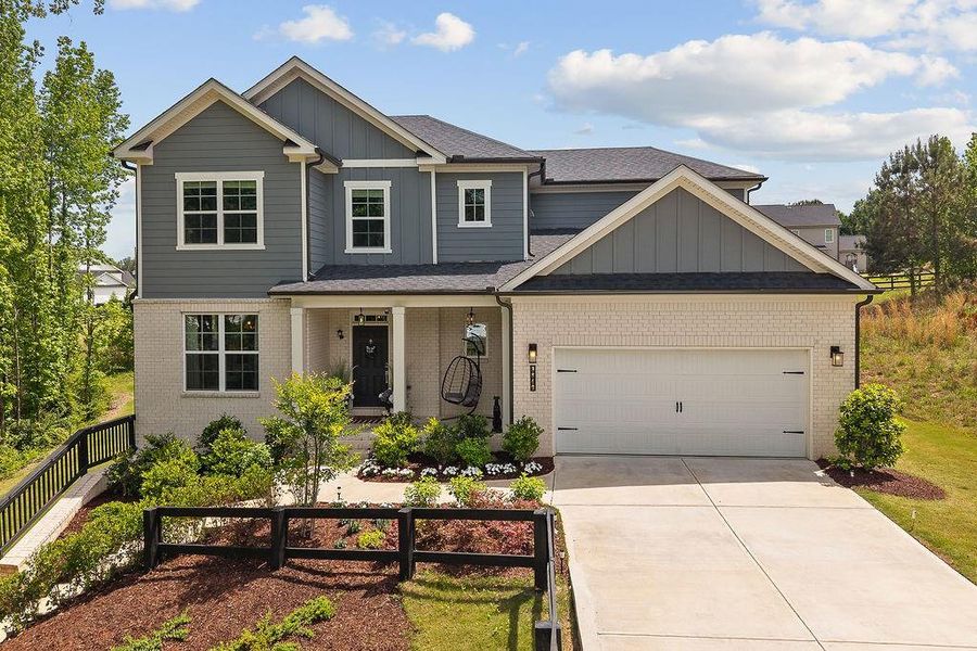 Front exterior of a new home in The Estate at Old Friendship, Buford, GA, highlighting curb appeal (Image 1). Front exterior of a new home in The Estate at Old Friendship, Buford, GA, highlighting curb appeal (Image 1).