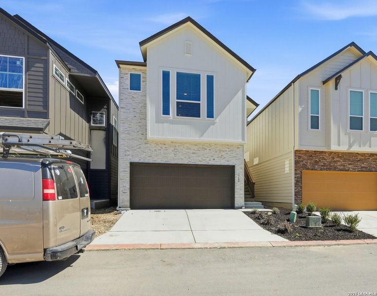 Front exterior of a new home in Rose Hill, San Antonio, TX, highlighting curb appeal (Image 24).