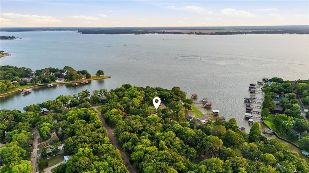 Expansive lakefront property featuring mature tree coverage, direct water access, and multiple boat slips Expansive lakefront property featuring mature tree coverage, direct water access, and multiple boat slips