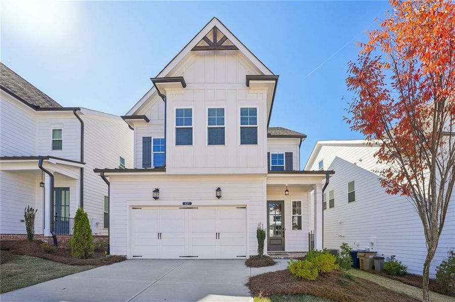 Front exterior of a new home in Palisades Single Family, Cumming, GA, highlighting curb appeal (Image 1).