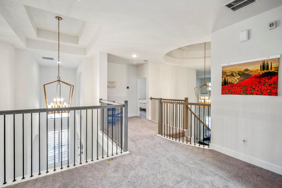 Headed the other direction is a secondary bedroom and full bath.