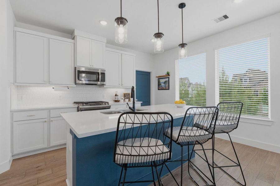 42" cabinets, under mount lighting and modern backsplash rounds out the kitchen highlights.
