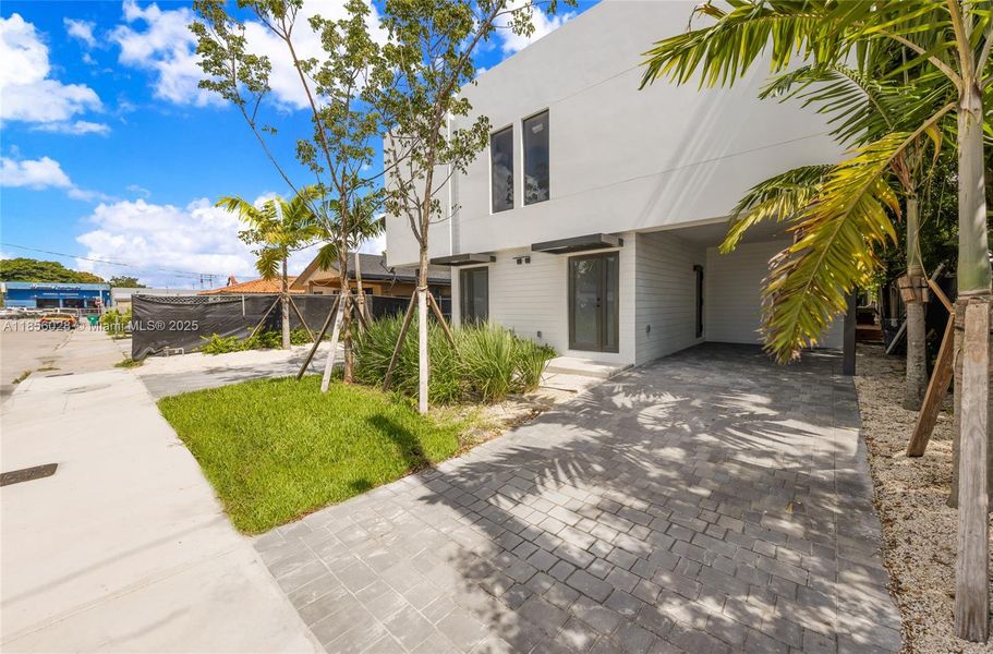 Front exterior of a new home in , Miami, FL, highlighting curb appeal (Image 14).