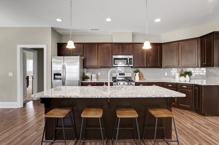 Representative furnished interior of a home built from the Sinclair by Bill Clark Homes in Osprey Landing, Southport (Image 8).