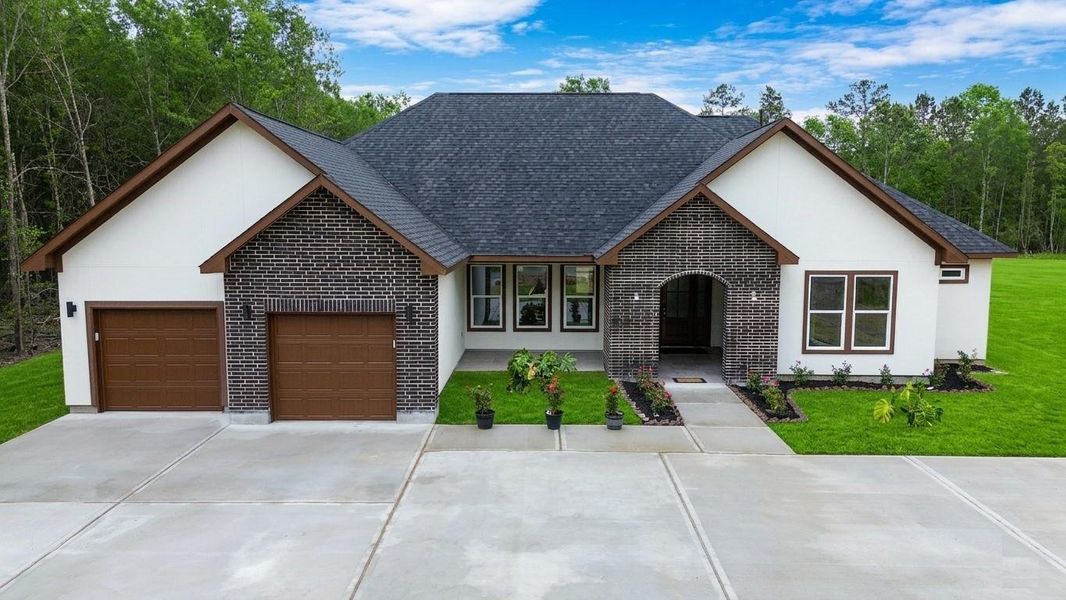Front exterior of a new home in , Dayton, TX, highlighting curb appeal (Image 20).