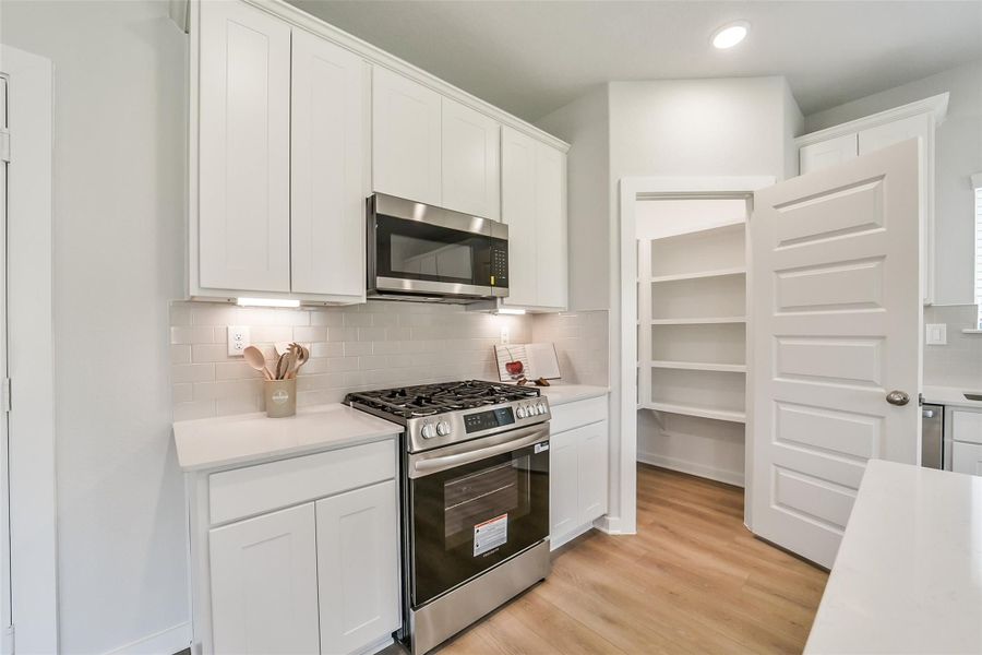 Furnished interior view inside a new home in Lakes at Black Oak, Magnolia (Image 12).