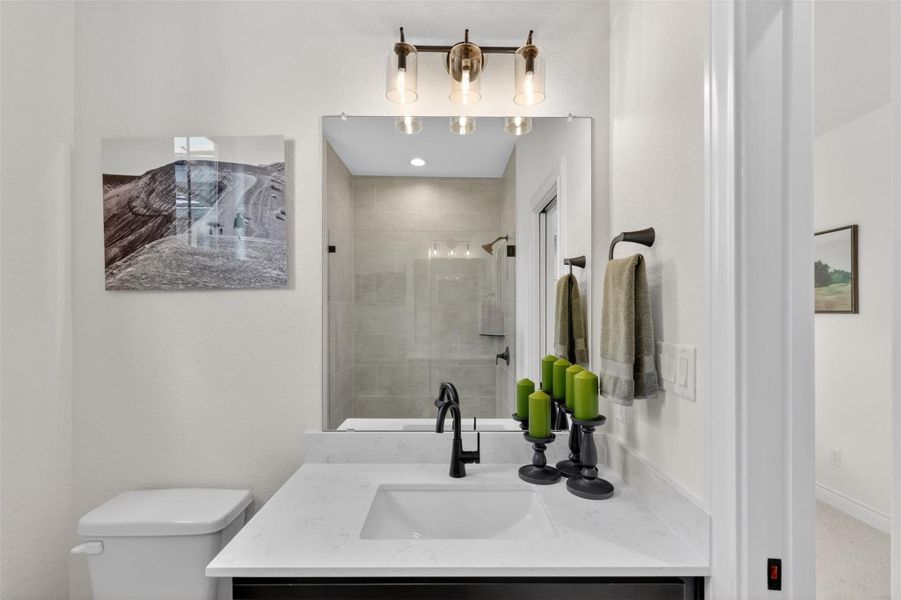 A well-appointed bathroom vanity features a broad counter and modern fixtures. A well-appointed bathroom vanity features a broad counter and modern fixtures.