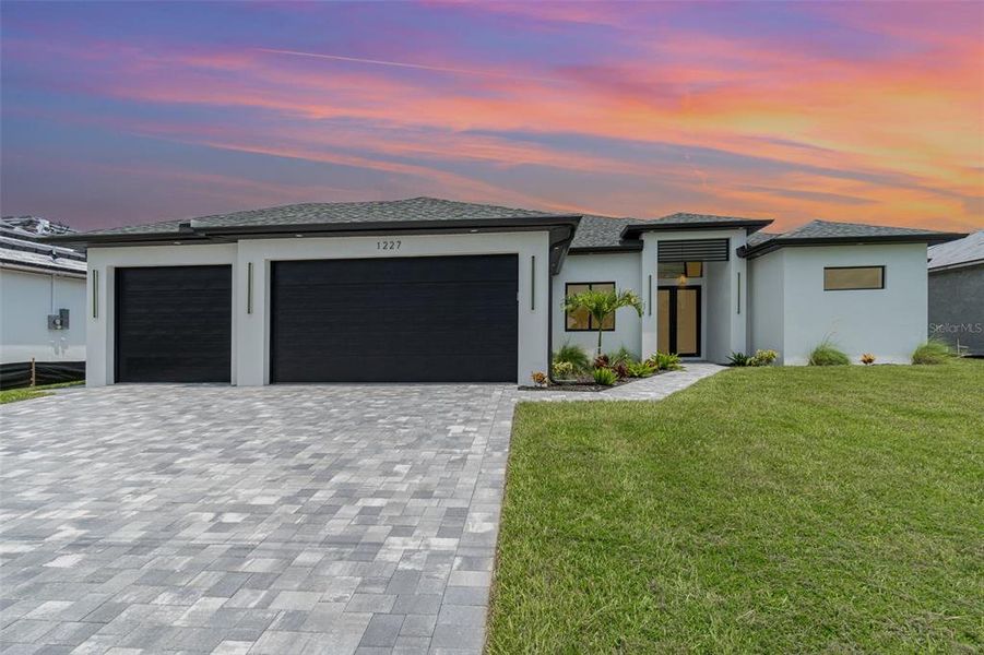 Front exterior of a new home in , Cape Coral, FL, highlighting curb appeal (Image 2).