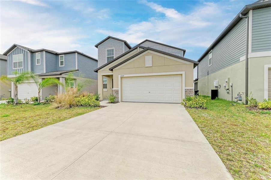Front exterior of a new home in , Parrish, FL, highlighting curb appeal (Image 21). Front exterior of a new home in , Parrish, FL, highlighting curb appeal (Image 21).