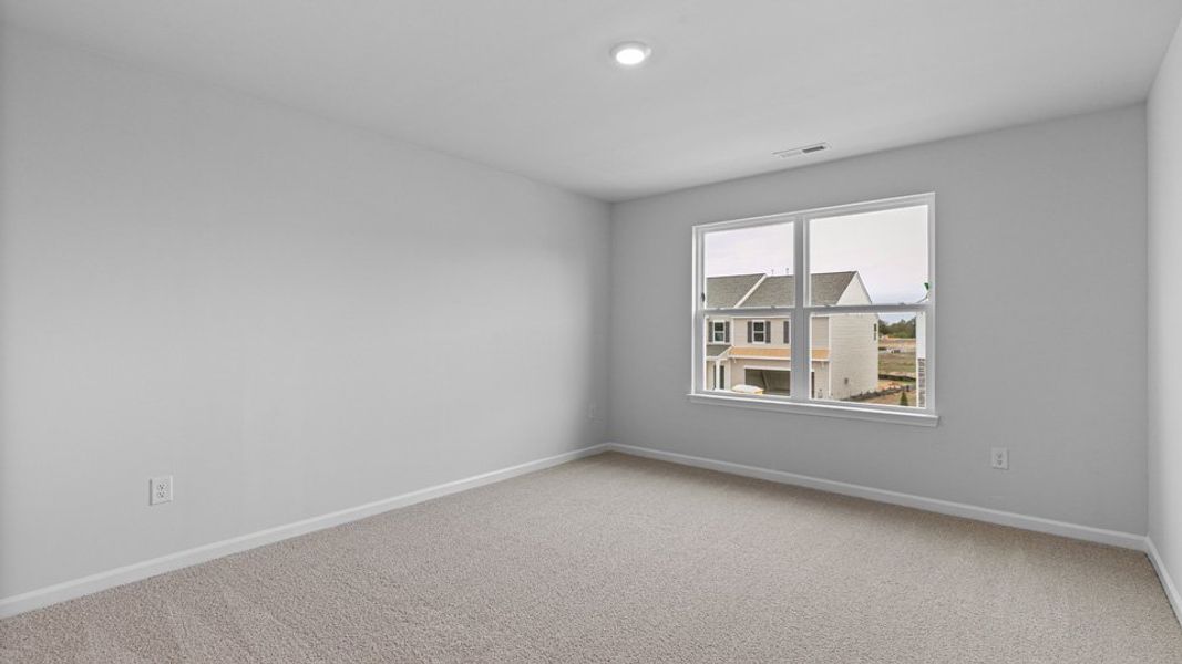 Spacious, unfurnished interior of a new home in The Reserve at Stoney Creek, Whitsett (Image 18).