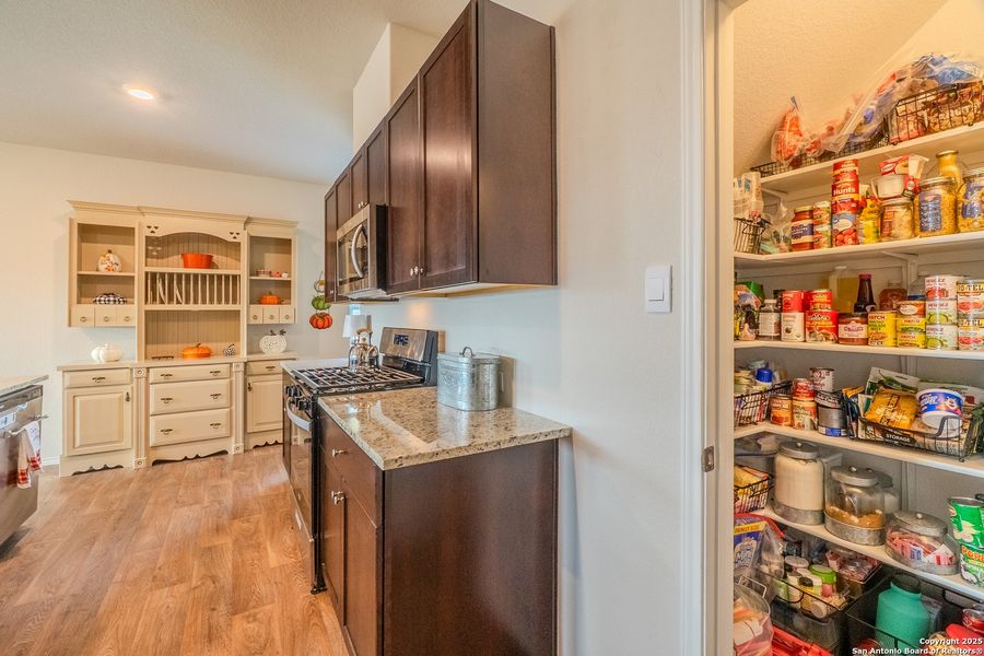 Furnished interior view inside a new home in The Links at River Bend, Floresville (Image 7).