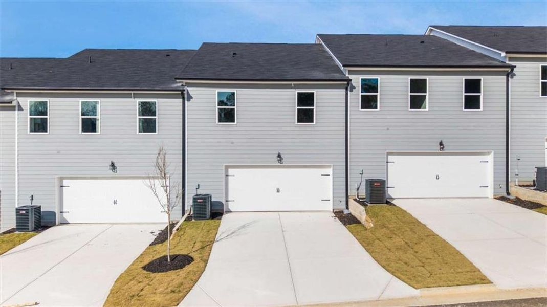 Front exterior of a new home in , Conyers, GA, highlighting curb appeal (Image 15).
