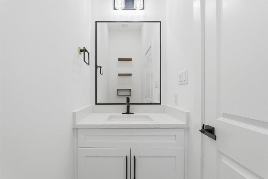 Convenient powder bath—a rare find in a one-story floor plan.
