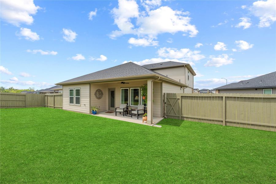 Covered back patio and fully fenced backyard on a 7,942 sq ft lot in Sorrento, with room to dine, grill and play.