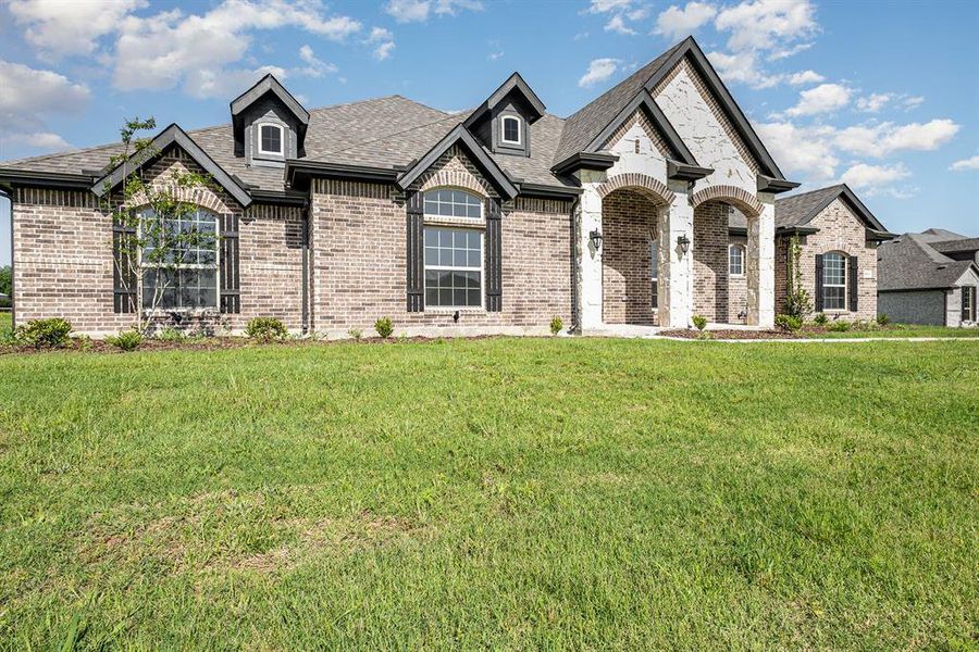 Front exterior of a new home in , Waxahachie, TX, highlighting curb appeal (Image 18).