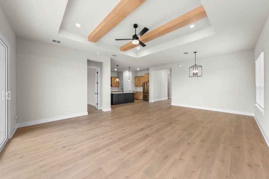This open layout makes entertaining easy and casual nights even better. Picture weekend breakfasts around the island, evening dinners that linger, and movie nights in the family room just steps away. Slide open the back door to enjoy the large covered patio. An ideal extension of your living space where you can soak up sunshine, grill out, or relax under the stars. This open layout makes entertaining easy and casual nights even better. Picture weekend breakfasts around the island, evening dinners that linger, and movie nights in the family room just steps away. Slide open the back door to enjoy the large covered patio. An ideal extension of your living space where you can soak up sunshine, grill out, or relax under the stars.