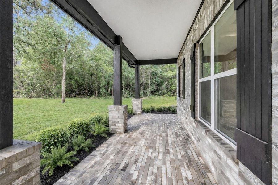 Morning coffeewill always taste better sittingunder this massive front porchoverlooking just the front of the1.5 acre lot.