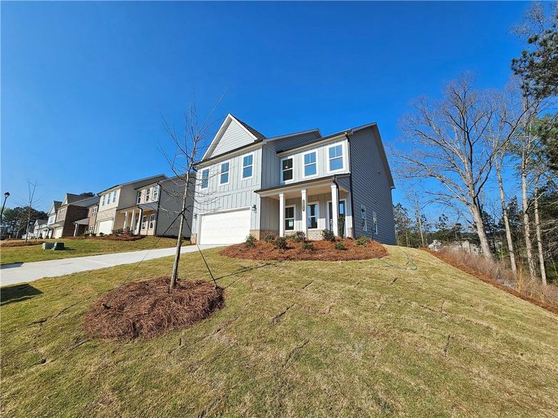 Front exterior of a new home in The Estates at Casteel, Bethlehem, GA, highlighting curb appeal (Image 10).