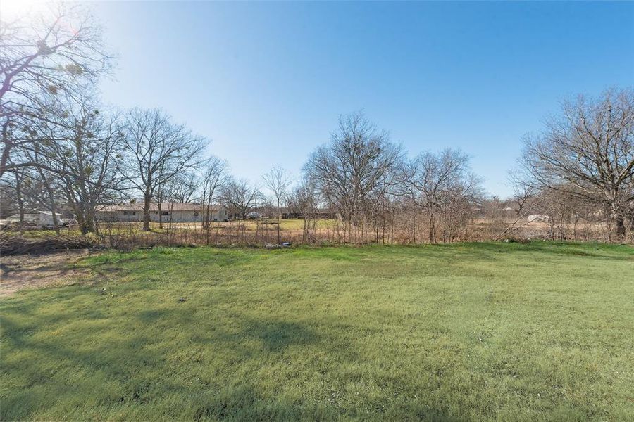 View of yard with a rural view