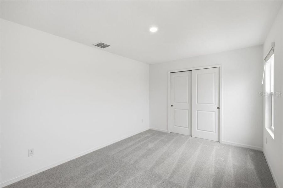 Spacious, unfurnished interior of a new home in Waterstone, Groveland (Image 25).