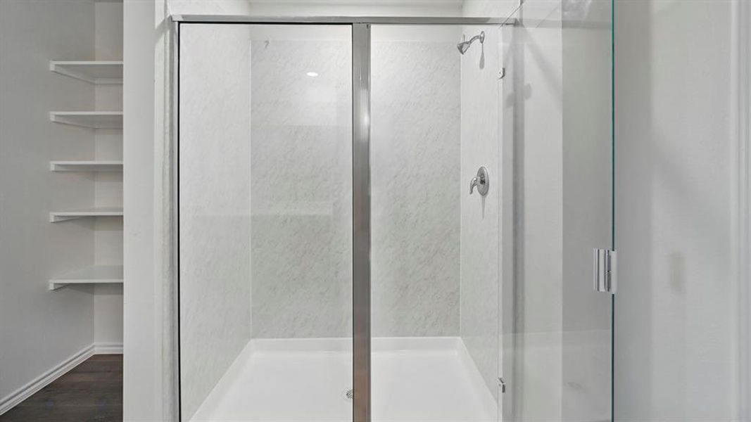 Full bath with a shower stall
