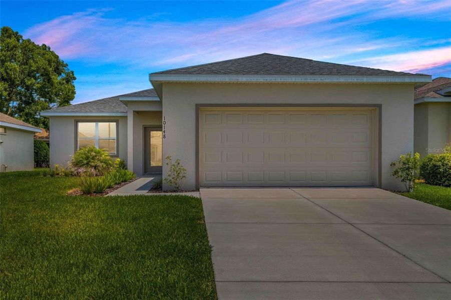 Front exterior of a new home in , Weeki Wachee, FL, highlighting curb appeal (Image 27).