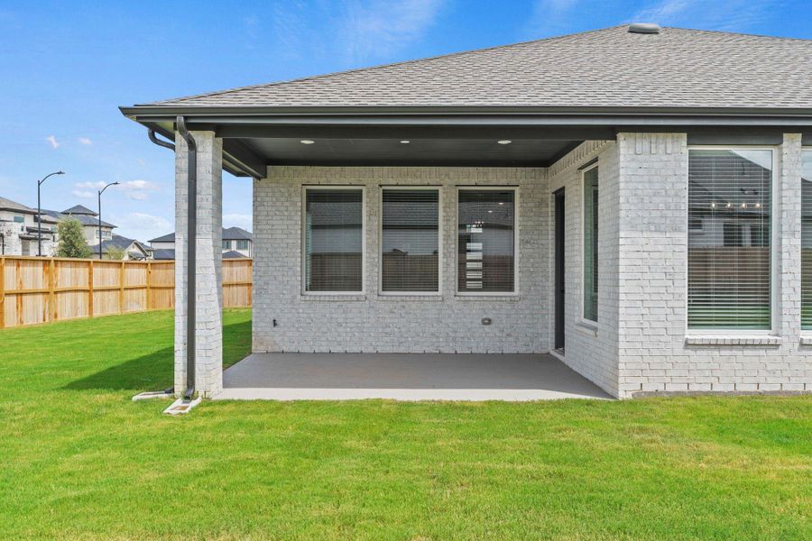 Exterior details and patio area of a home in Elyson 60's, Katy (Image 3). Exterior details and patio area of a home in Elyson 60's, Katy (Image 3).