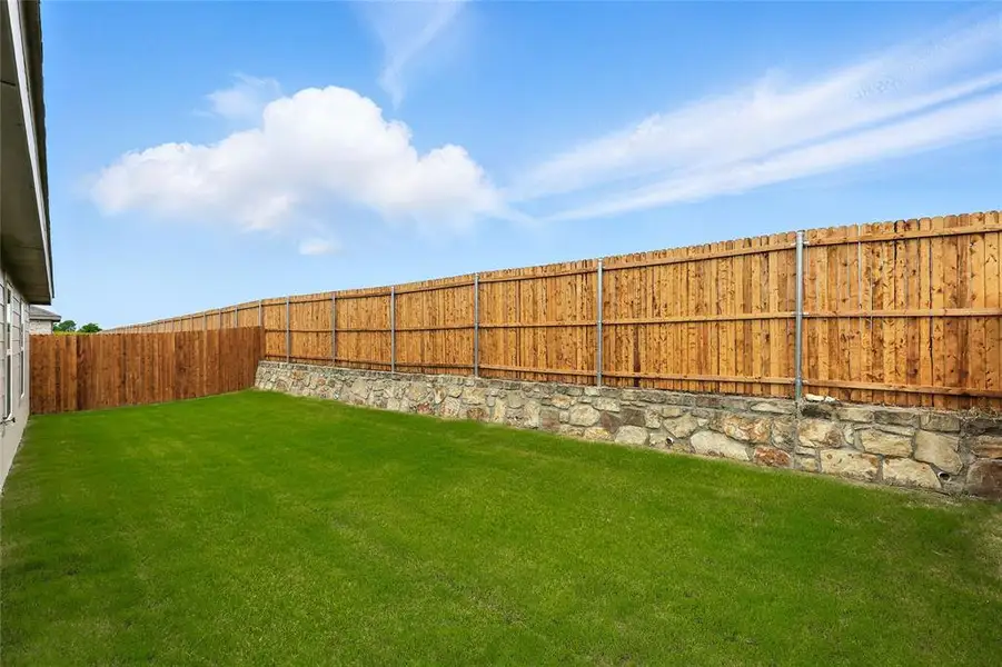 View of fenced backyard