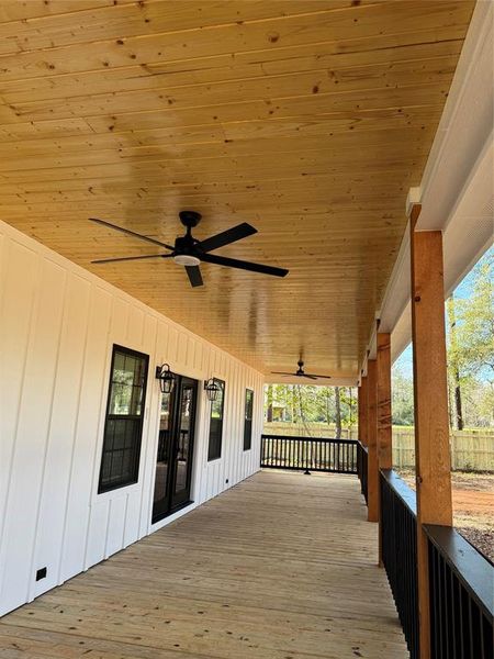 Large covered front porch to enjoy your morning coffee!  Remote controlled ceiling fans, cedar posts and tongue and groove wood ceiling.