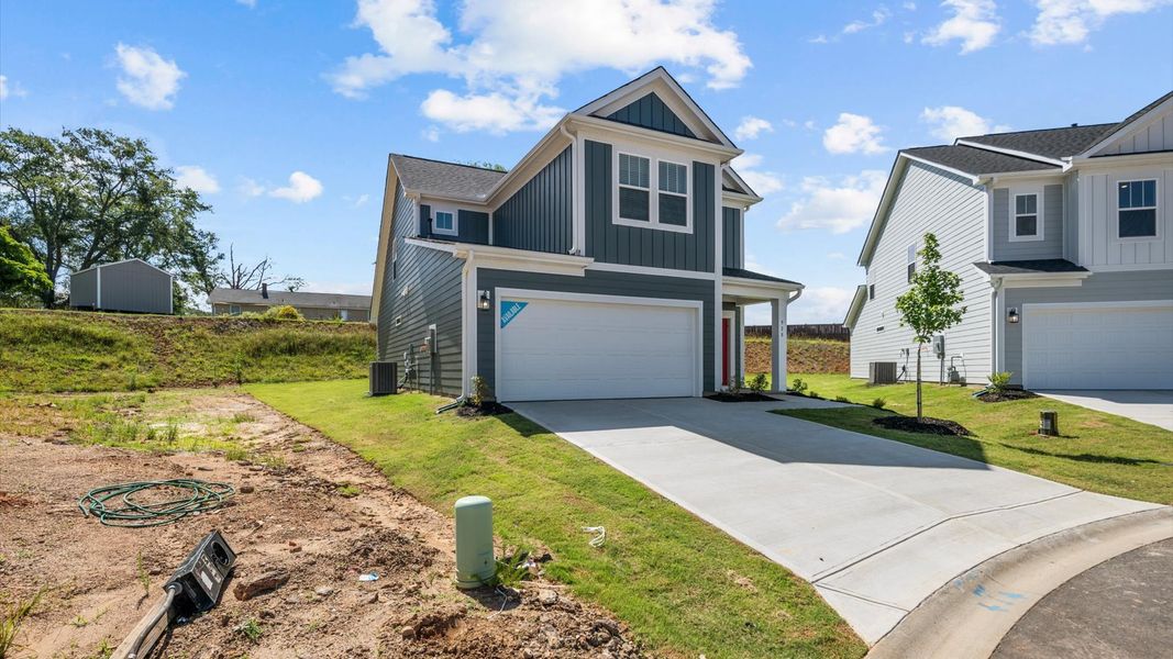 Representative exterior photo of a completed home built from the Freesia by DRB Homes in Spring Branch, Smyrna, TN (Image 25).