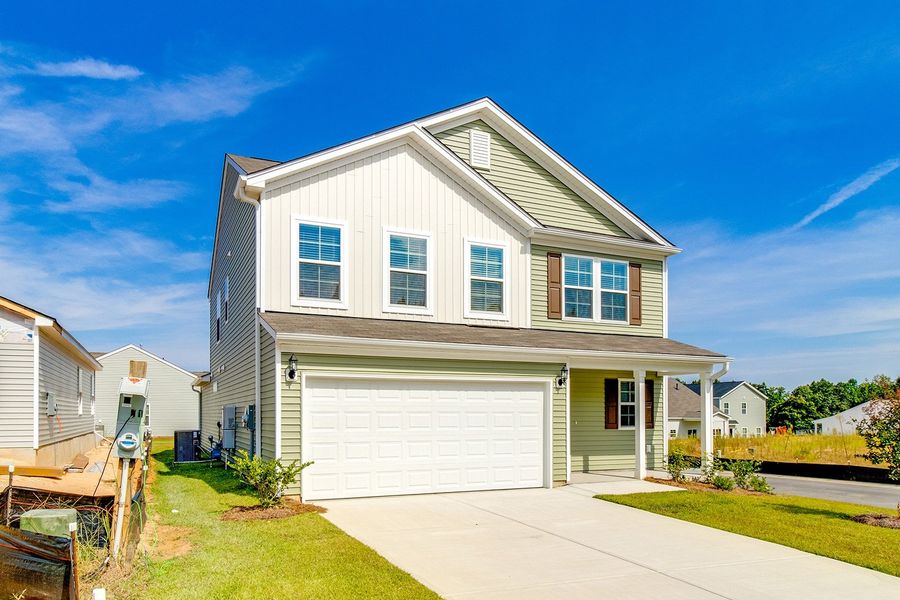 Front exterior of a new home in Winston Point, Gilbert, SC, highlighting curb appeal (Image 2). Front exterior of a new home in Winston Point, Gilbert, SC, highlighting curb appeal (Image 2).