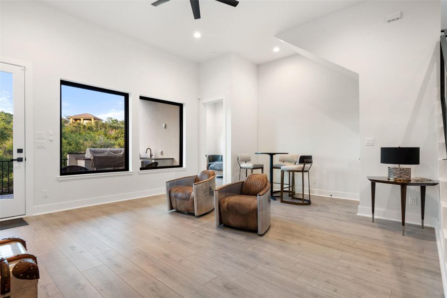 Designed for unforgettable entertaining, the lower level features a barrel-ceiling home theater, expansive game room, stylish bar, and temperature-controlled wine cellar.