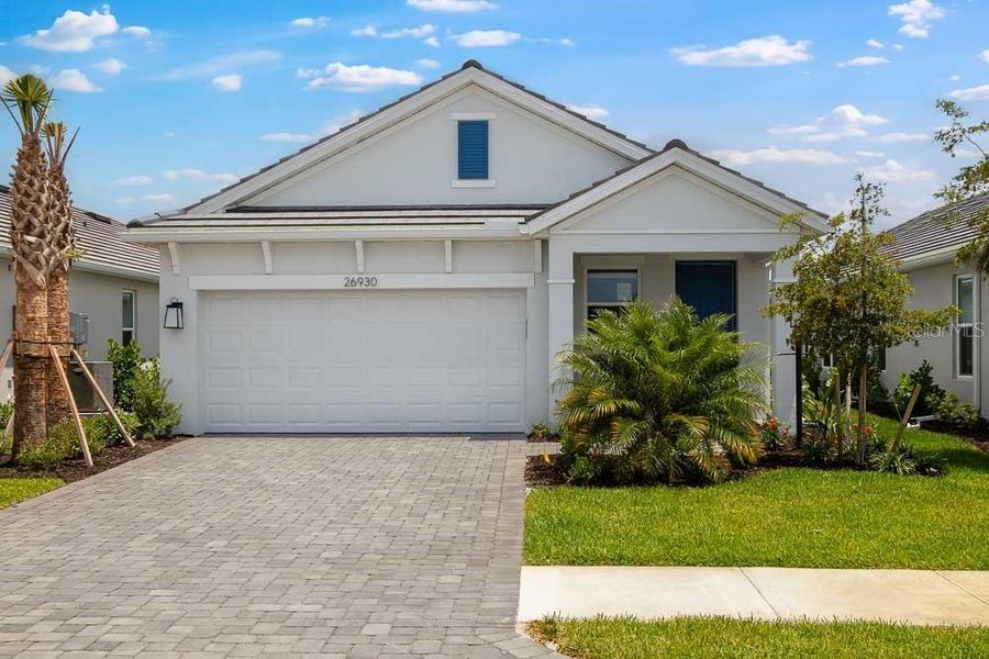 Front exterior of a new home in Esplanade at Starling, Punta Gorda, FL, highlighting curb appeal (Image 1). Front exterior of a new home in Esplanade at Starling, Punta Gorda, FL, highlighting curb appeal (Image 1).