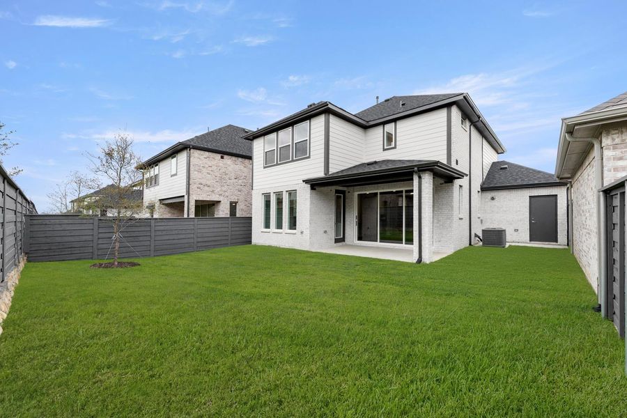 Exterior details and patio area of a home in Union Park, Little Elm (Image 16).