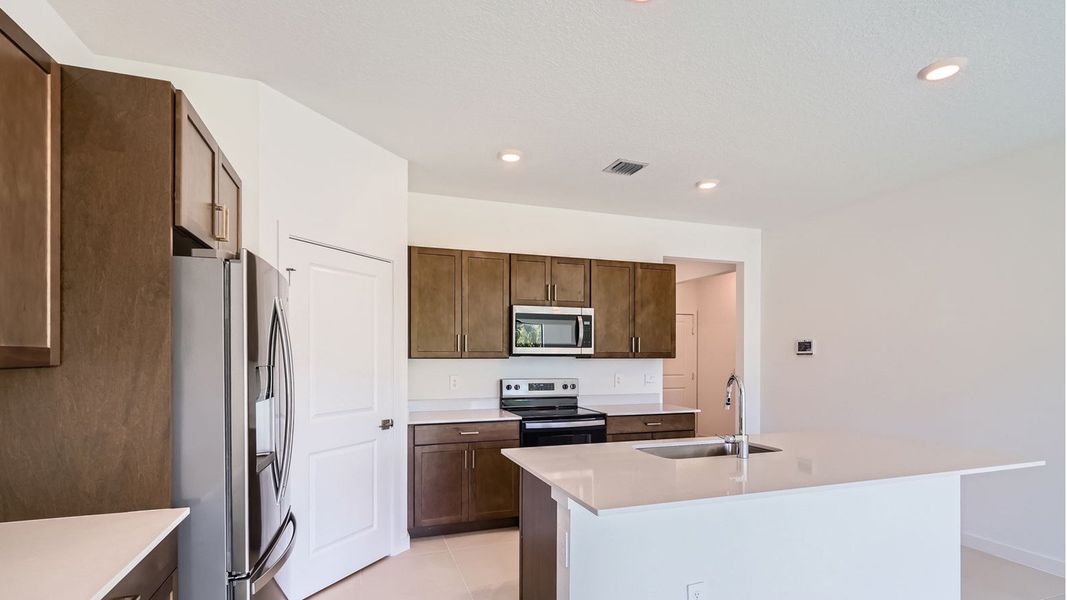 Representative furnished interior of a home built from the Cali by D.R. Horton in Twin Oaks, Stuart (Image 6).