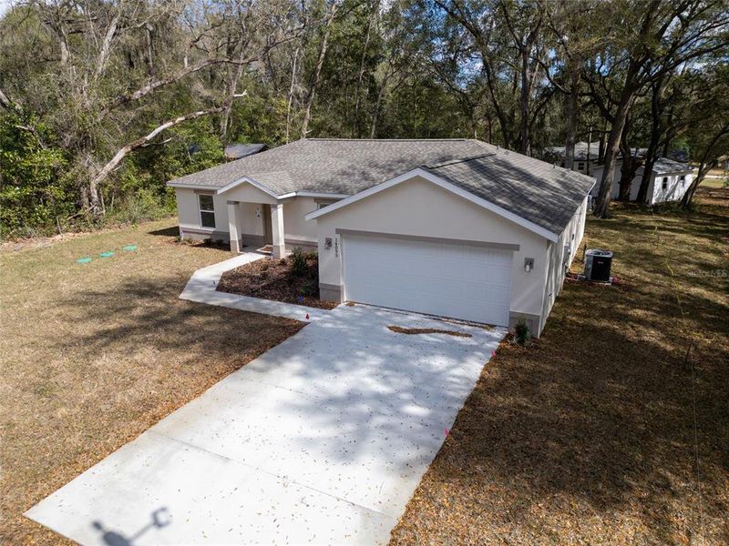Front exterior of a new home in , Summerfield, FL, highlighting curb appeal (Image 26).