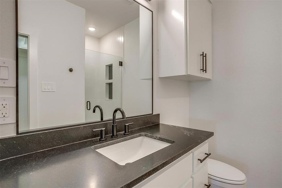 Bathroom featuring toilet and vanity