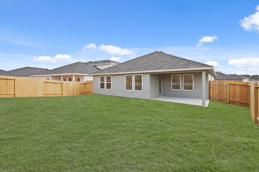 Exterior details and patio area of a home in Grand Pines, Magnolia (Image 3).