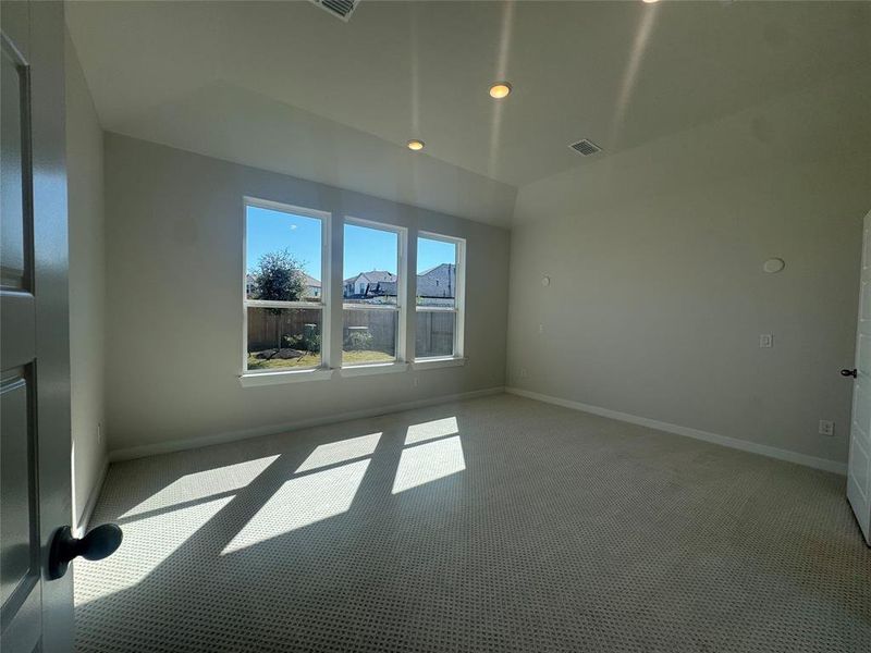 Main bedroom is nestled in the rear of the home with a fantastic view of the backyard.