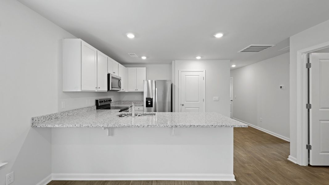 Furnished interior view inside a new home in Pine Hills at Cane Bay, Summerville (Image 3).