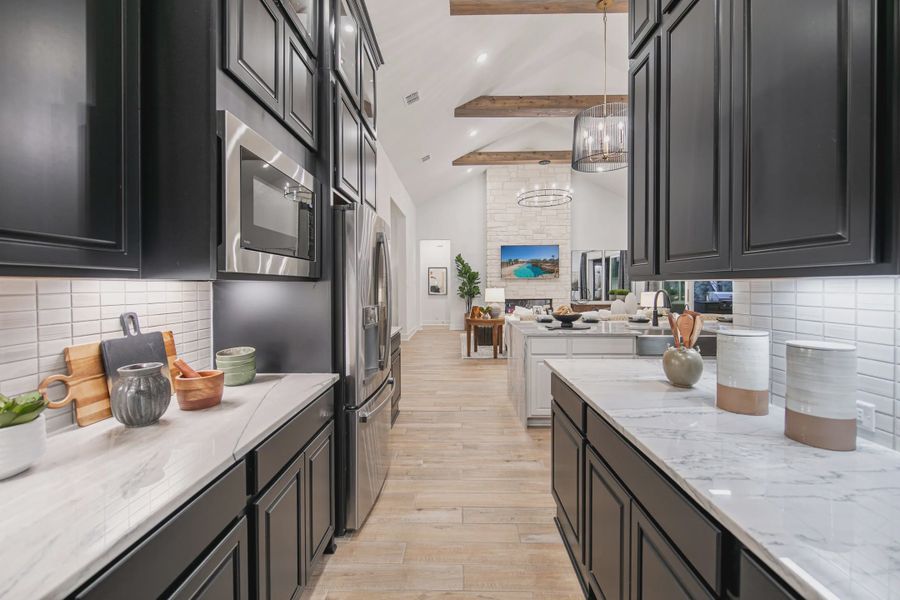 Representative furnished interior of a home built from the Raven by Chesmar Homes in Potranco Oaks 100's, Castroville (Image 6).