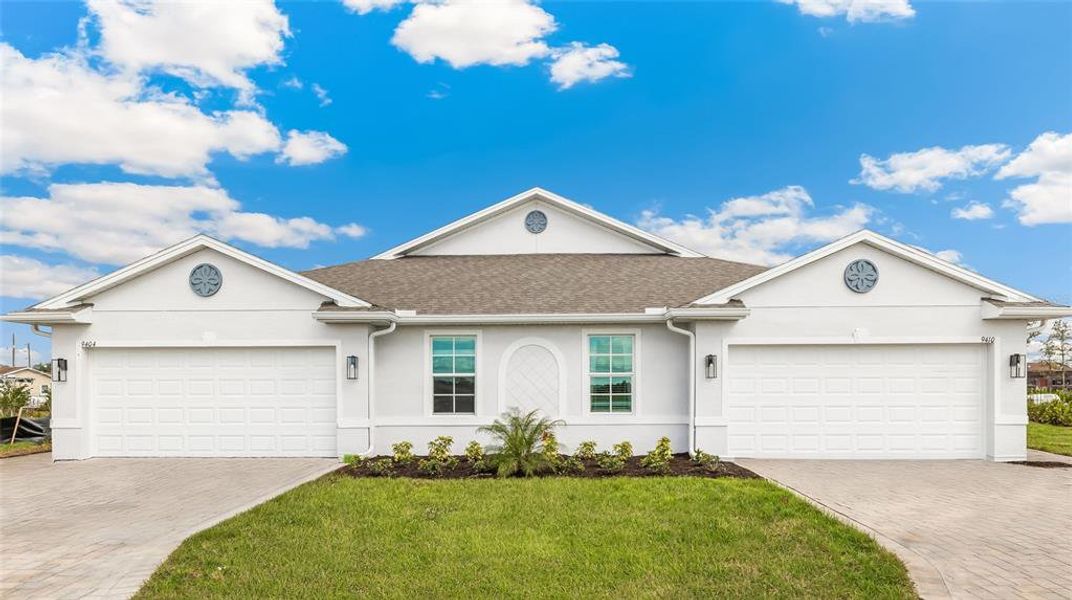 Front exterior of a new home in Sea Cove, Punta Gorda, FL, highlighting curb appeal (Image 1).