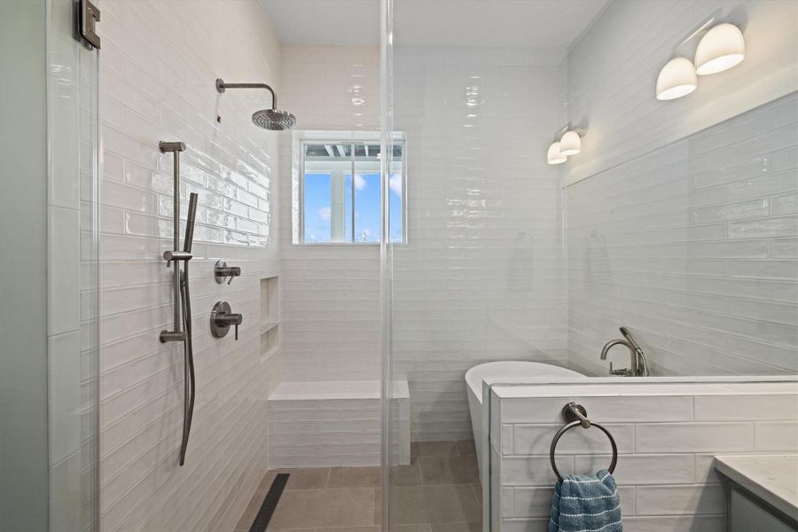 Primary Bath offers a large walk-in shower and soaking tub